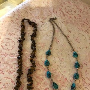 Two. Necklace sold in s bundle or individually.